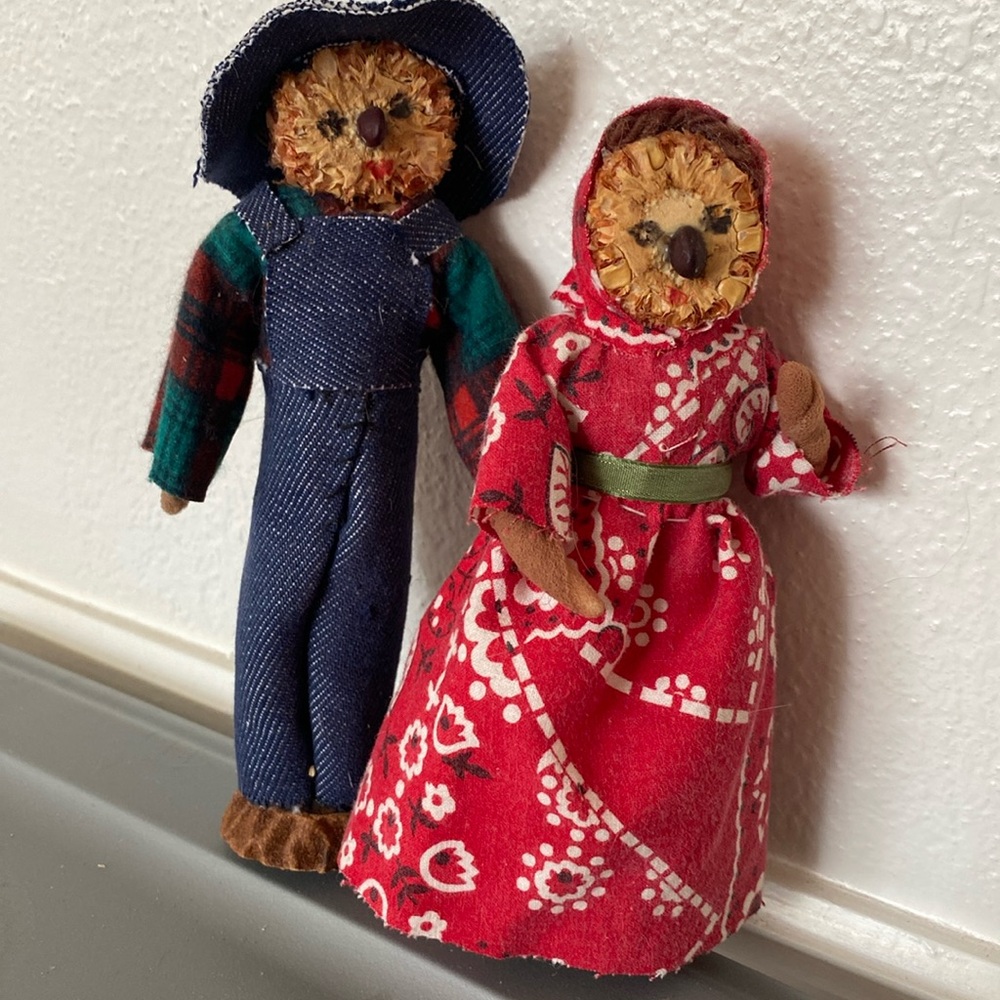 Cute folk art corn cob face farmer couple.